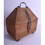 AN EARLY 20TH CENTURY INDIAN WICKER AND BRASS BOX of triangular form. 23 cm x 26 cm.
