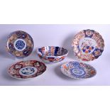 FOUR JAPANESE MEIJI PERIOD IMARI PLATES together with a similar bowl. Largest 18 cm diameter. (5)
