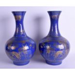 A RARE PAIR OF 19TH CENTURY CHINESE POWDER BLUE BULBOUS VASE Qing, unusually gilded with spotted de