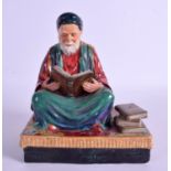 A RARE PORCELAIN REGINALD JOHNSON STUDIO POTTERY FIGURE depicting Tunisian Scholar of Law. 22 cm x