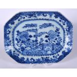 AN 18TH CENTURY CHINESE BLUE AND WHITE OCTAGONAL PORCELAIN PLATTER, painted with flowering rock, Qi