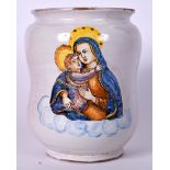 A 19TH CENTURY ITALIAN MAJOLICA OR MAIOLICA POTTERY DRUG JAR, painted with the Virgin Mary. 21 cm x