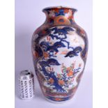 A LARGE 19TH CENTURY JAPANESE MEIJI PERIOD IMARI VASE painted with foliage. 37 cm high.