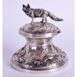 A 19TH CENTURY CONTINENTAL SILVER INKWELL decorated with hunting scenes. 6.5 oz. 9 cm wide.