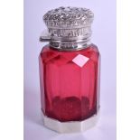 A 19TH CENTURY RUBY GLASS SCENT BOTTLE overlaid in silver. 6.75 cm high.