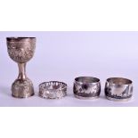 A PAIR OF CONTINENTAL SILVER NIELLO NAPKIN RINGS together with another & a cup. 3.8 oz. (4)