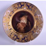 A FINE ANTIQUE VIENNA PORCELAIN CABINET PLATE painted with a male smoking a pipe. 21 cm diameter.