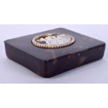 A LATE VICTORIAN/EDWARDIAN CARVED TORTOISESHELL BOX carved with a cameo encased within seed pearls.