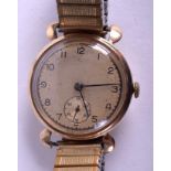 A VINTAGE 9CT GOLD WRISTWATCH with flexible strap. 3 cm diameter.