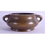 A 17TH/18TH CENTURY CHINESE TWIN HANDLED BRONZE CENSER Kangxi/Yongzheng. 1314 grams. 13.5 cm not in