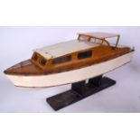 A 1970'S MODEL MOTOR CRUISER BOAT, with associated plinth. 77 cm wide.