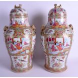 A LARGE PAIR OF LATE 19TH CENTURY CHINESE FAMILLE ROSE VASES AND COVERS Qing. 44 cm x 18 cm.