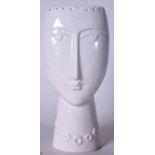 AN ABSTRACT WHITE PORCELAIN VASE IN THE FORM OF A FEMALE FACE, formed with an elongated nose. 30 cm