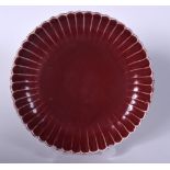 A CHINESE OX BLOOD GLAZED PORCELAIN DISH BEARING XUANDE MARKS, petal in shaped, 20th century. 21.5