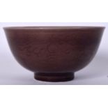 A CHINESE AUBERGINE GLAZED TEABOWL Guangxu mark and possibly of the period. 10 cm wide.