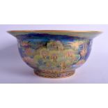 A RARE WEDGWOOD FAIRYLAND LUSTRE PORCELAIN BOWL by Daisy Makeig Jones, painted with goblins and fai