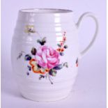 AN 18TH CENTURY DERBY EARLY MUG painted with flowers and scattered foliage. 9.5 cm high.