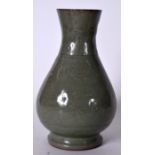 A 19TH CENTURY CHINESE CELADON GLAZED PORCELAIN VASE, incised with trailing vines. 25 cm high.