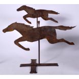AN EARLY 20TH CENTURY WEATHER VANE IN THE FORM OF TWO HORSES, modelled galloping. 48 cm x 55 cm.