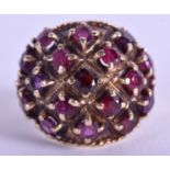 A 9CT GOLD GARNET AND RUBY RING. 8.2 grams. Size O/P.