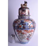 A VERY LARGE 19TH CENTURY JAPANESE MEIJI PERIOD IMARI VASE AND COVER painted with a girl and a pair
