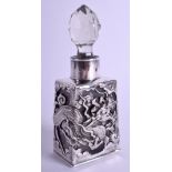 A 19TH CENTURY JAPANESE MEIJI PERIOD YOKOHAMA SILVER OVERLAID SCENT BOTTLE decorated with dragons.