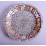 AN UNUSUAL INDIAN GOA CARVED MOTHER OF PEARL FLOWER DISH decorated with a central floral roundel. 2