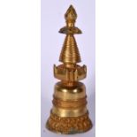 A GILT BRONZE STUPA, formed upon a double beaded lotus base. 23.5 cm high.