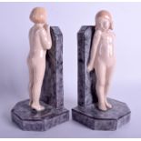 AN UNUSUAL PAIR OF ART POTTERY R BERNARD FIGURAL BOOKENDS modelled as nude females. 22 cm x 10 cm.