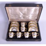 A CASED ANTIQUE H & C CZECH CHODAU SET OF CUPS AND SAUCERS painted with gilt. (12)