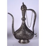 A LARGE ISLAMIC WHITE METAL EWER, decorated with extensive foliage. 44.5 cm high.