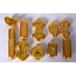 A COLLECTION OF TEN CHINESE YELLOW METAL INGOTS, varying size and shape. (10)