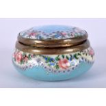 AN EARLY 20TH CENTURY ENAMEL PILL BOX painted with roses and flowers. 5 cm wide.