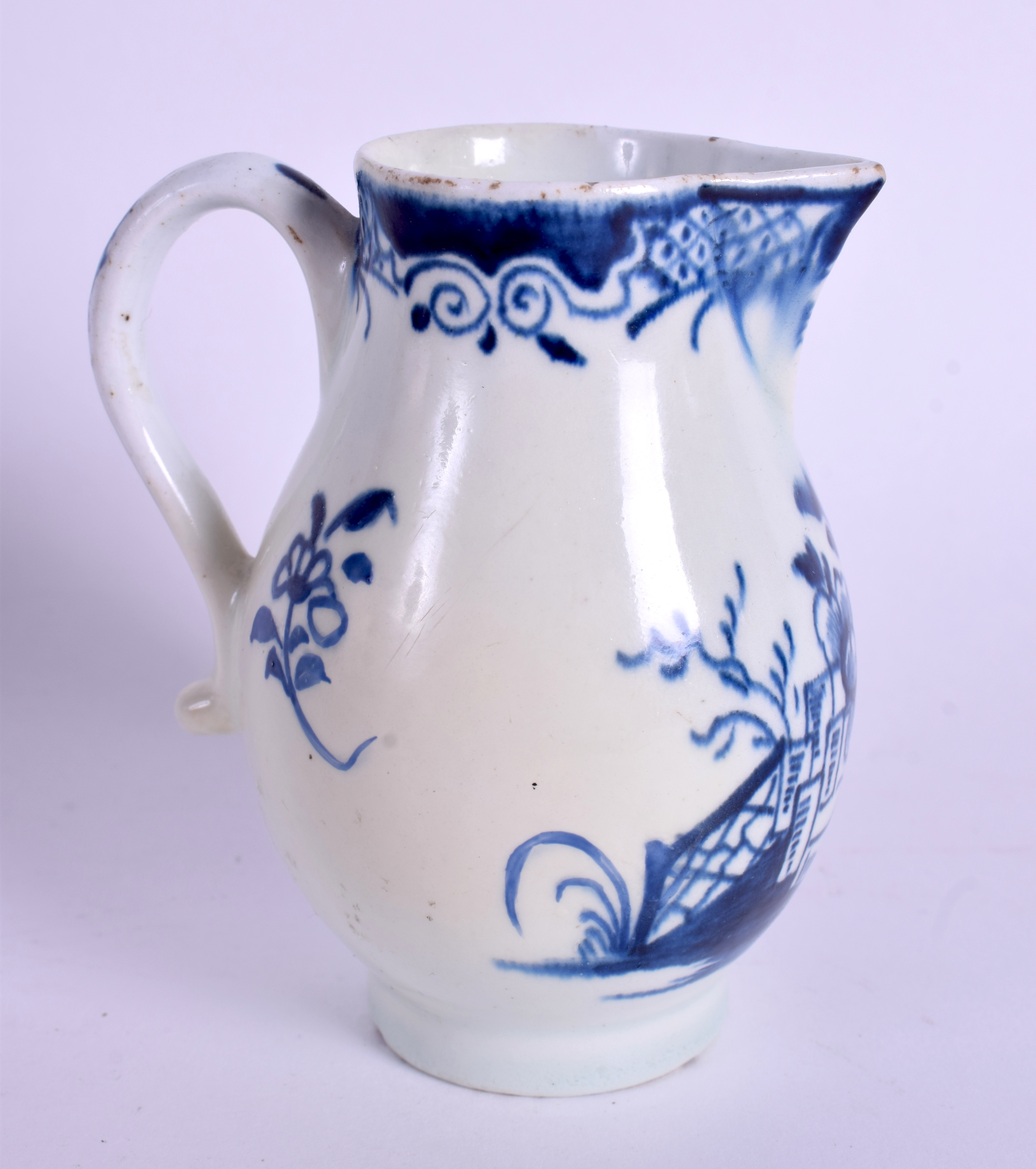A GOOD 18TH CENTURY LOWESTOFT SPARROW BEAK JUG painted with a fenced garden and flowering plant. 8. - Image 2 of 3