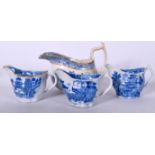 THREE CAUGHLEY OR COALPORT LOW CHELSEA EWERS, decorated in blue chinoiserie scenes, together with a