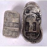 TWO CHINESE WHITE METAL INGOT, of varying design. Largest 8 cm wide. (2)