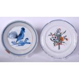 AN ANTIQUE FAIENCE TIN GLAZED POTTERY DISH PAINTED WITH A COCKERAL, together with another painted w