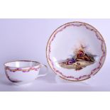 AN 18TH CENTURY MEISSEN FINE TEACUP AND SAUCER painted with a Middle Eastern battle scene, under a