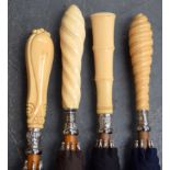 A GROUP OF FOUR ANTIQUE IVORY UMBRELLAS, formed with later mounts, of varying design. (4)
