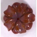 A CARVED AGATE FLOWER, possibly a pendant or brooch. 4.25 cm wide.