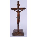 AN 18TH CENTURY CONTINENTAL FRUITWOOD FOLK ART CRUCIFIX. 30 cm x 11 cm.