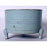 A LARGE CHINESE SUNG STYLE PALE BLUE BRUSH WASHER, formed with ribbed body upon three curving feet.