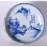AN EARLY 20TH CENTURY JAPANESE BLUE AND WHITE PORCELAIN BOWL, decorated with figures in a landscape