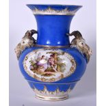 A 19TH CENTURY KPM BERLIN PORCELAIN VASE, formed with goat head handles and decorated with lovers i