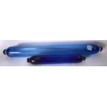 A LARGE LATE 19TH CENTURY BLUE GLASS ROLLING PIN, together with a smaller example. Largest 78 cm. (