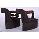 A PAIR OF ANTIQUE IRONS,formed with wooden handles. 26 cm wide.