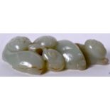 A 20TH CENTURY CHINESE CARVED GREEN JADE FIGURE OF THREE CATS, formed eating lingzhi fungus. 9 cm w