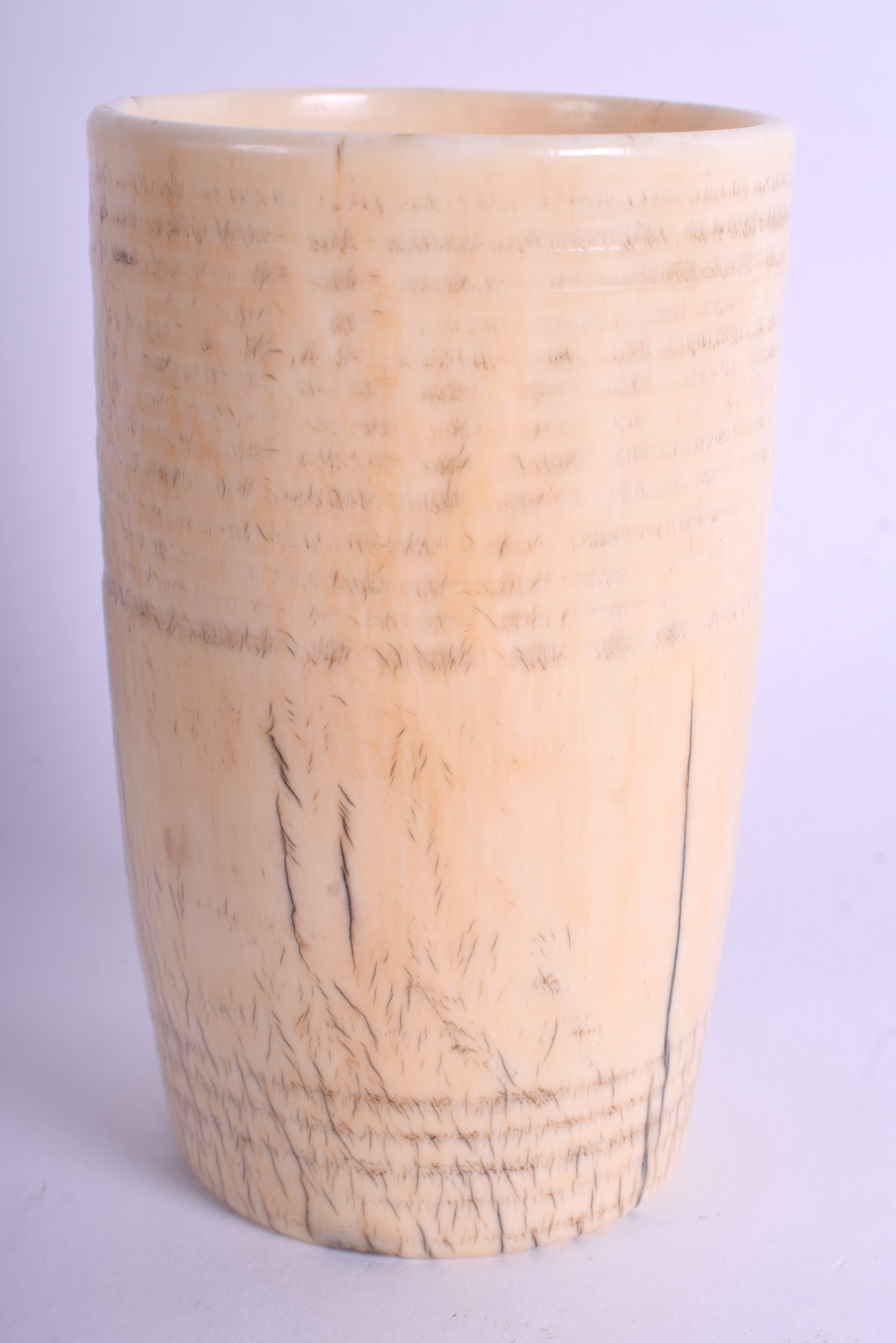 A 17TH CENTURY EUROPEAN CARVED IVORY RIBBED BEAKER C1670 of plain form. 171 grams. 9.5 cm x 5.5 cm.