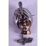 A RARE VINTAGE ENGLISH SILVER AND AMETHYST BROOCH in the form of a female wearing a turban. 2.25 cm