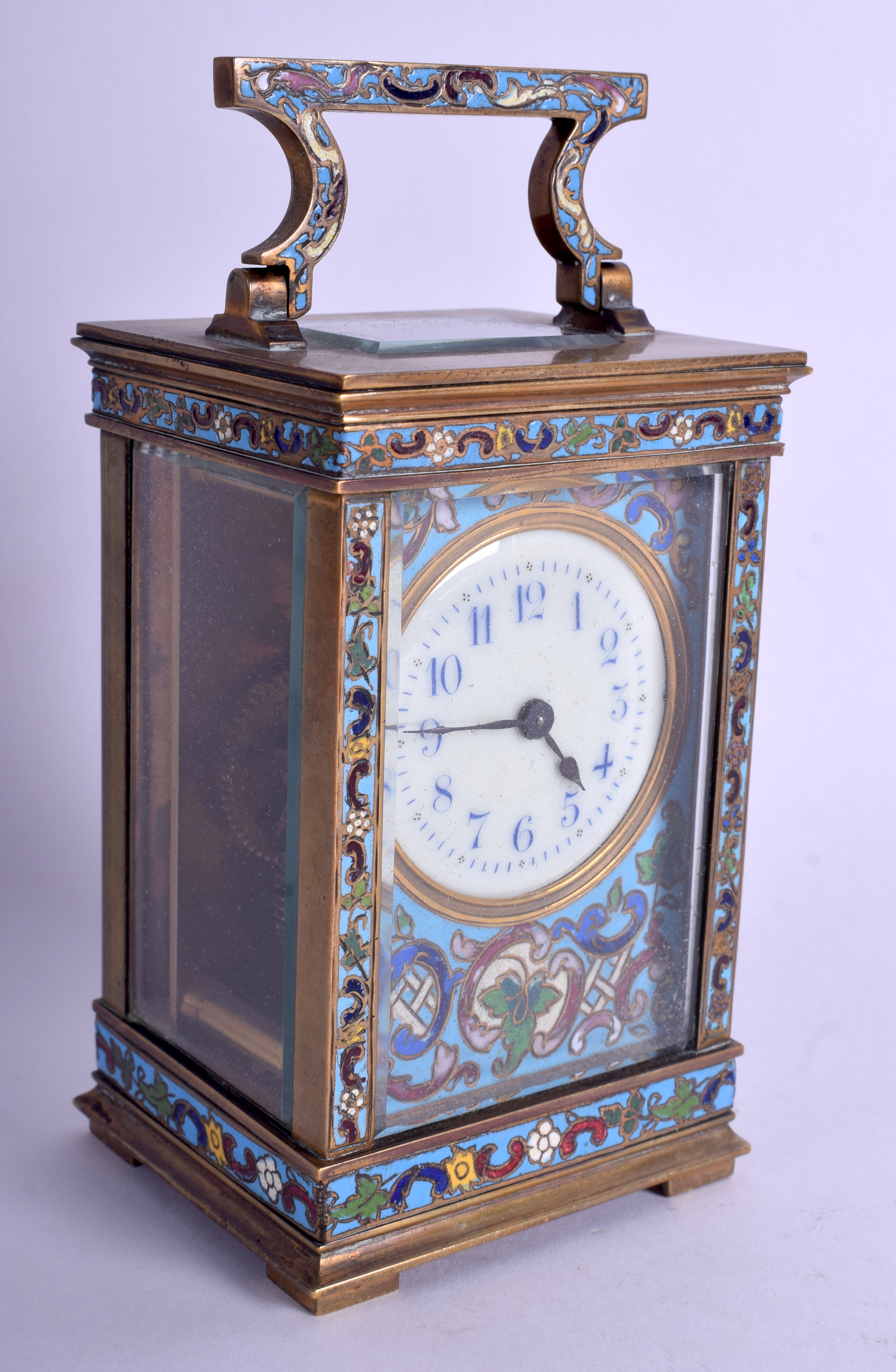 A LATE 19TH CENTURY FRENCH CHAMPLEVÉ ENAMEL BRASS CARRIAGE CLOCK decorated with foliage and vines.